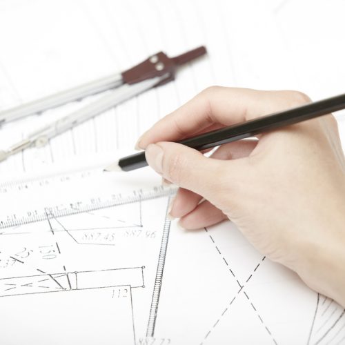 Engineering Hands of engineer working on a construction plan